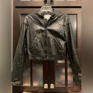 Black Faux Leather full zip jacket. With stylish zipper on sleeves.